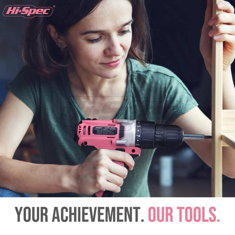 Person using pink cordless drill set 18V with 18Nm torque, 550 RPM, bit set for wood, steel, concrete, home repairs and DIY