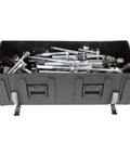 Road Ready Drum Hardware Case With Wheels And Telescoping Handle Featuring Hella Durable Roto Molded Polyethylene Construction Secure Cinch Straps For Stands Pedals And Gear Hauling Black filled with chrome drum hardware.
