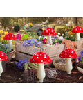 8 Pack Red Mushroom Solar Lights For Outdoor Garden Decor With 8 Lighting Modes set in colorful garden scene