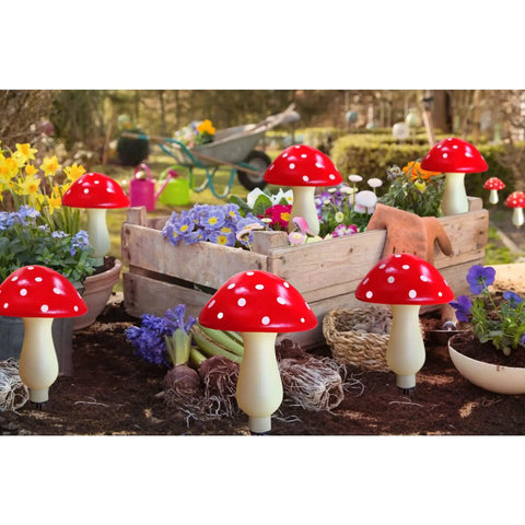 8 Pack Red Mushroom Solar Lights For Outdoor Garden Decor With 8 Lighting Modes set in colorful garden scene