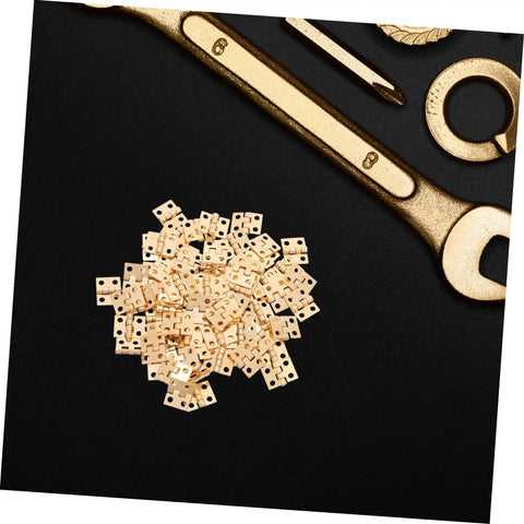 Tiny Brass Door Hinges 8x10mm Set Of 100 for DIY craft projects and miniature boxes with gold tools background.