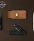 Tan Leather Multitool Holster For Suspension And Suspension NXT Belt Clip Pouch with accessories on dark background.