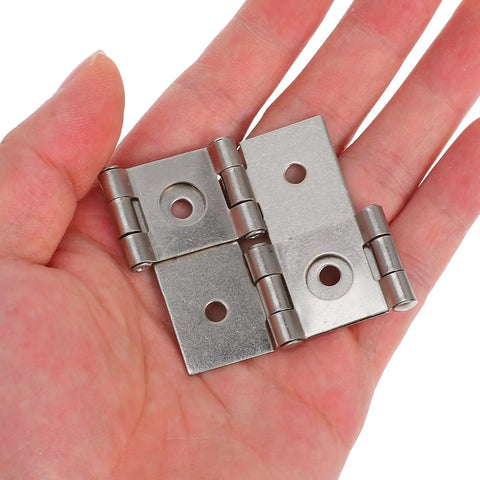 Set of Four Silver Iron Dual Action Swing Door Hinges for Screens and Furniture, 25mm Hole Spacing and 4.3mm Hole Diameter in hand