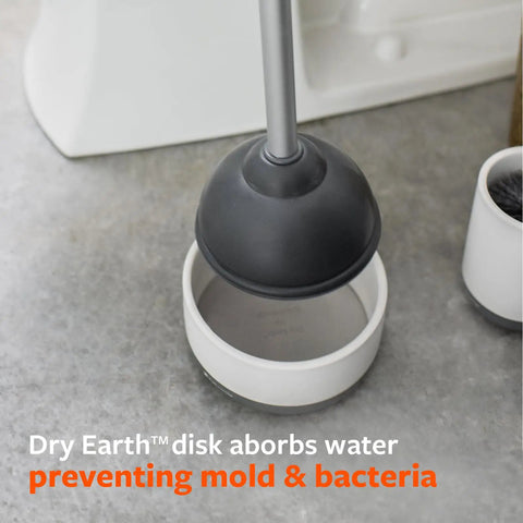 Game Changing Toilet Plunger With Ceramic Holder And Instant Dry Coating for mold prevention, shown upright in bathroom.