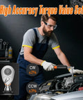 Mechanic using digital torque wrench with LCD display for precision auto repair under hood in garage.