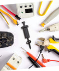 Assorted electrical tools and connectors for DIY projects on a white background, including pliers, wires, and a voltage tester.