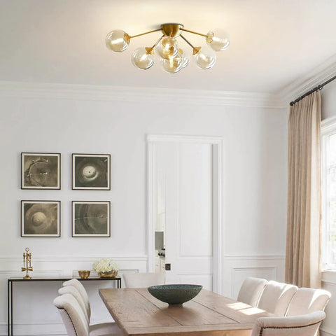 Seven Light Mid Century Modern Flush Mount Ceiling Light With Amber Glass Sputnik Globes Brass Gold Finish living room view