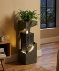 35.4 Inch Tall Indoor Outdoor Dope Waterfall Fountain with LED Lights, resin floor-standing in room setting, plant on top