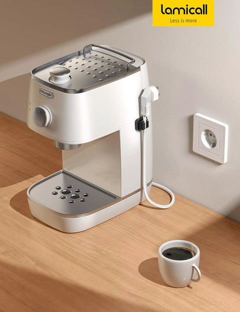 White coffee machine on wooden counter with cup of coffee, featuring 5 Pack Cable Spring Holder Clips For Desk Organization.