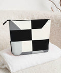 Level Up Your Packing Game With This Legit Black And White Piano Grid Print Large Toiletry Bag Crafted From Water Repellent Polyester Fabric For Hassle Free Travel Essentials And Cosmetics, showing a black and white grid print.