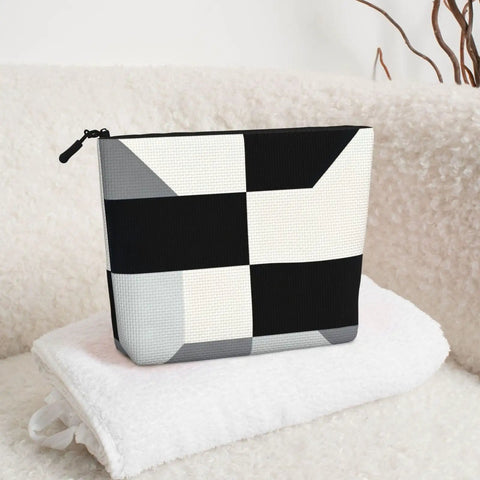 Level Up Your Packing Game With This Legit Black And White Piano Grid Print Large Toiletry Bag Crafted From Water Repellent Polyester Fabric For Hassle Free Travel Essentials And Cosmetics, showing a black and white grid print.
