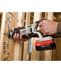 Compact 20V Max Cordless Reciprocating Saw With Variable Speed And Quick Release Blades cutting through wood on job site.