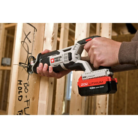 Compact 20V Max Cordless Reciprocating Saw With Variable Speed And Quick Release Blades cutting through wood on job site.