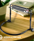 Hands Free Harmonica Holder With Adjustable Neck Frame For Musicians Industry Standard Go To Sturdy Harp Stand Fits Most Harps Pro Grade German Made Black on table.