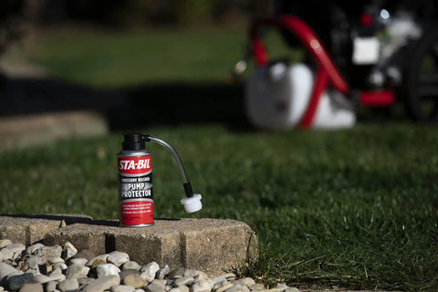 Pump Protector For Pressure Washer Storage With Next Gen Anti Freeze And Lubricant Formula 4 Oz on a garden surface