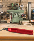 Red RB3000 metal deburring tool with knurled grip on wooden workbench