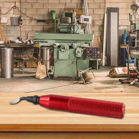 Red RB3000 metal deburring tool with knurled grip on wooden workbench