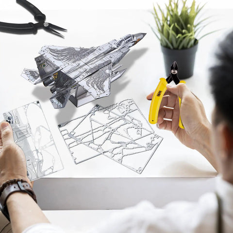 Person assembling F-15 Fighter Jet Metal Model Kit for Adults, DIY 3D Puzzle to Build at Home, with detailed metal sheets.