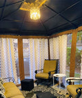 Cozy room with Plug In Vintage Crystal Pendant Light With Chain, Black Metal Frame, Dimmable K9 Crystal Beams, 16.4 Ft Cord, hanging from ceiling.