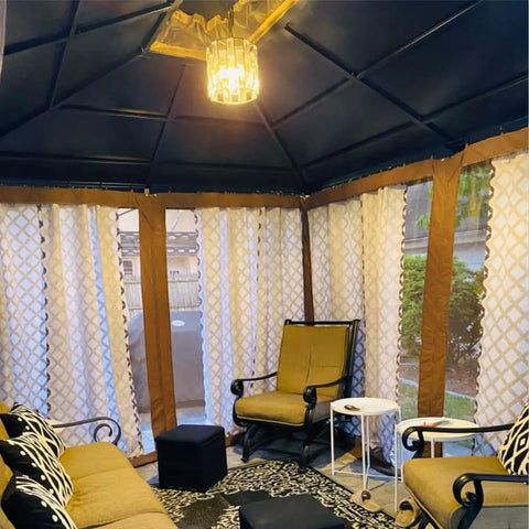 Cozy room with Plug In Vintage Crystal Pendant Light With Chain, Black Metal Frame, Dimmable K9 Crystal Beams, 16.4 Ft Cord, hanging from ceiling.