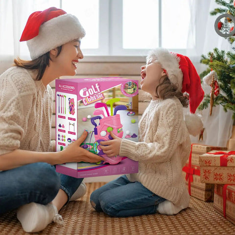 Toddler Golf Set With Putting Mat For Ages 3 To 5 4 Clubs 8 Balls 2 Practice Holes Indoor Outdoor Play Kid Friendly Portable Carry Strap And Storage Bag 20 Piece gift box held by child and adult in festive hats.