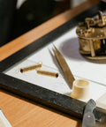 Clock Tension Springs Replacement Kit For Wall Clocks And Alarm Clocks with alloy extension springs and tools on table