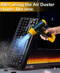 Hand using Powerful Cordless Electric Air Duster And Blower For Tech Cleaning Keyboard PC And Cameras on a keyboard
