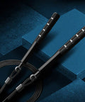 Black Speed Jump Rope For Training And Fitness, Adjustable Length Tangle Free Rope With Dual Bearings on blue background
