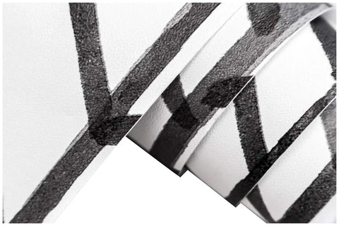 Close-up of roll showing Peel And Stick Black And White Herringbone Wallpaper With Self Adhesive Vinyl Decor Easy Install No Mess Durable And Removable For Accent Walls And Cabinets.