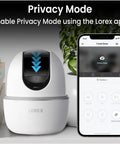 Indoor WiFi Security Camera With Pan And Tilt 4MP HD Sensor 360 Degree Coverage next to smartphone showing privacy mode app