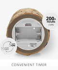 Bottom view of Birch Bark Wrapped Flameless LED Candle with timer and battery compartment visible, promoting convenient use.