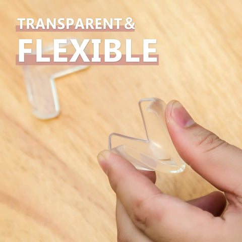 Transparent corner protector being held, part of 12 Pack Transparent Corner Protectors For Tables And Desks Soft Pvc Furniture Edge Bumpers.
