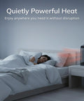 Oscillating Ceramic Tower Space Heater with Adjustable Thermostat and Two Quiet Heat Settings in bedroom next to bed
