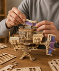 Hands assembling Fun 3D Wooden Airship Puzzle Kit for Teens and Adults, Pine Wood Mechanical Flying Ship Build on table.