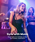 Women dancing in a club with mood lighting highlighting the party atmosphere.