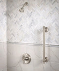 Bathroom scene with Brantford Brushed Nickel Posi Temp Shower Trim Kit with high pressure showerhead, lever handle, and tub spout