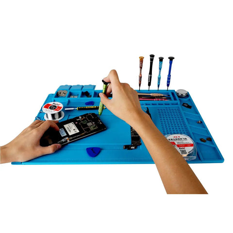Hands using Magnetic Silicone Soldering Mat Work Station Pro Gear With Built In Ruler For Precise DIY Repairs 4 Magnetic Work Zones.