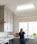 Dimmable 2 Foot LED Flush Mount Ceiling Light 20W 2200lm Cool White 4000K Kitchen Fixture Four Pack Energy Saving Easy Wall Switch Dimming Bright Modern Lighting installed in a kitchen ceiling.