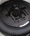 Spare Tire Bolt Retainer Clamp For CRV Durable Car Wheel Accessory with Easy Install shown in trunk with tool set.