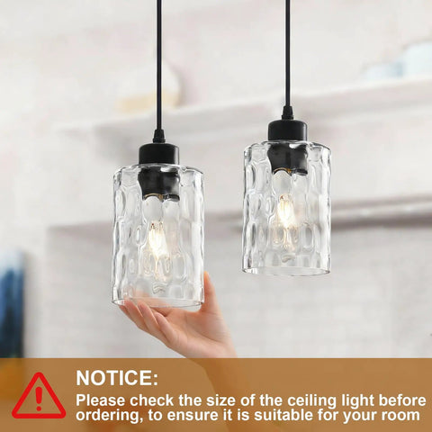 Two Pack Black Hammered Glass Pendant Lights With Adjustable Cords For Kitchen Island modern hanging lamp fixtures showcased with hand.