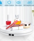 Tuanse 10 Inch Electric Motorized Rotating Turntable Cup Display Stand With Led Light, 360 Degree Product Showcase For Shop Jewelry Photography Video, White, showing cosmetics and perfume.