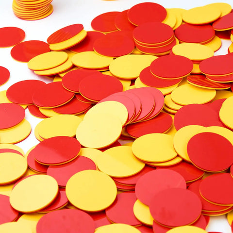 Two Sided Red And Yellow Counting Chips 1000 Piece Set scattered on a surface, ideal for preschool math manipulatives and activities.