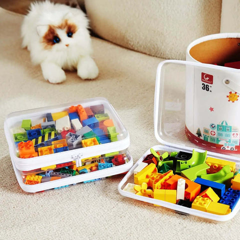 Hella Tough Four Piece Clear Hard Shell Case With Secure Zipper Closure organizing colorful Lego pieces on a carpeted surface.