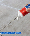 Hand applying All Purpose Tile Crack Filler Adhesive For Tiles And Surfaces High Strength Repair Paste For Ceramic Porcelain Glass Fiberglass And Stone Quick Set Smooth Spreading Durable Bond Glossy Finish Fast Acting Repair on tile crack