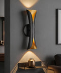 Flynix LED Indoor Wall Sconces, 5 Color Temps Dimmable Hardwired Wall Light on wall with gold and black design.