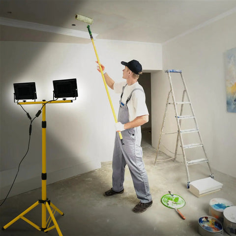 Painter using Two-Head LED Work Light With Adjustable Foldable Tripod Stand, 21000 Lumen Portable Flood Light for illumination