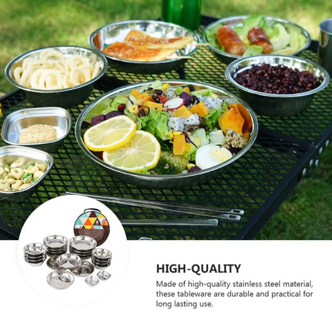 Stainless Steel Outdoor Dining Set With Plates Bowls And Cutlery on a table, ready for beach BBQ hiking and picnics.