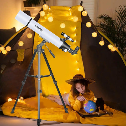 Child stargazing with 80mm Aperture 900mm Focal Length Refractor Telescope in tent, glowing lights, globe, books nearby