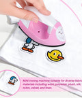 GoLashFun Cute Pink Mini Heat Press For Fuse Beads in use on fabric with playful patches, perfect lightweight craft tool.