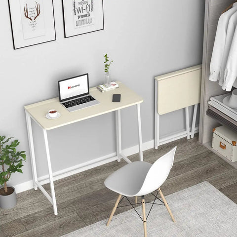 Compact Folding Desk For Small Spaces 31.5 Inch Oak Finish Computer Table in home office with chair, laptop, and accessories.